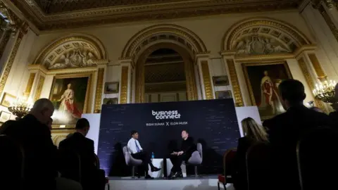 Reuters Rishi Sunak and Elon Musk on stage together
